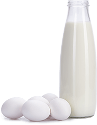 eggs beside a glass bottle of milk
